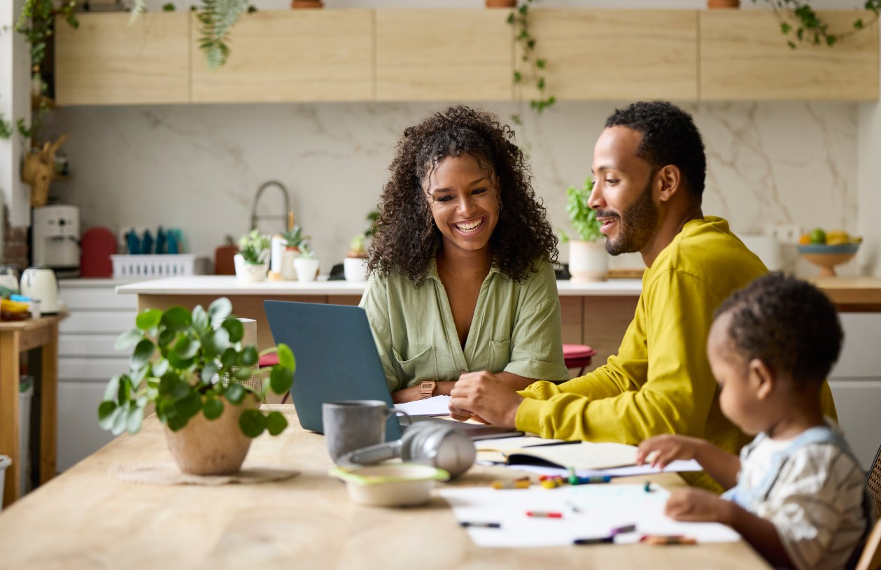 Family filing taxes at the kitchen table 