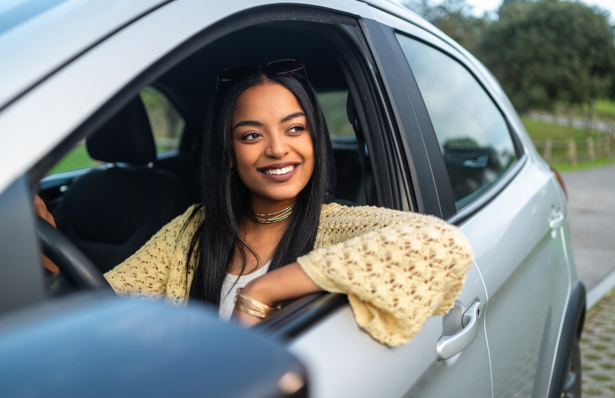 Woman drives off in a new car