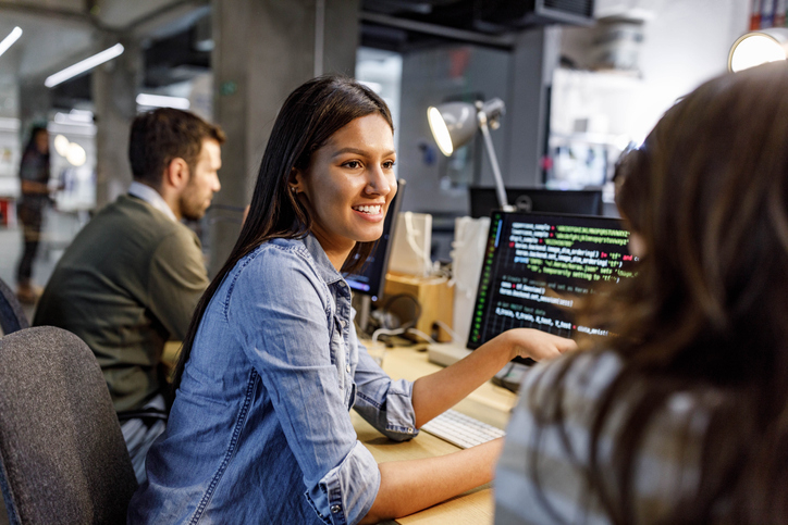 Latina employee discusses support of digital equity in the workplace with her coworkers.