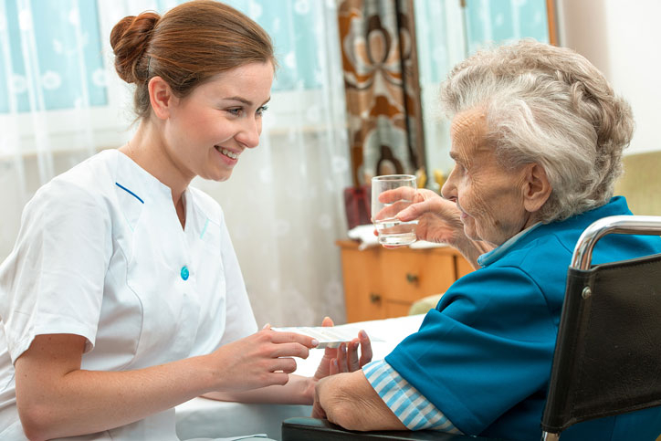 Caregiver helping woman