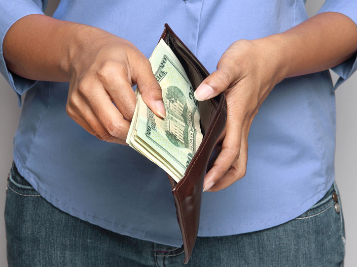 person pulling cash from wallet