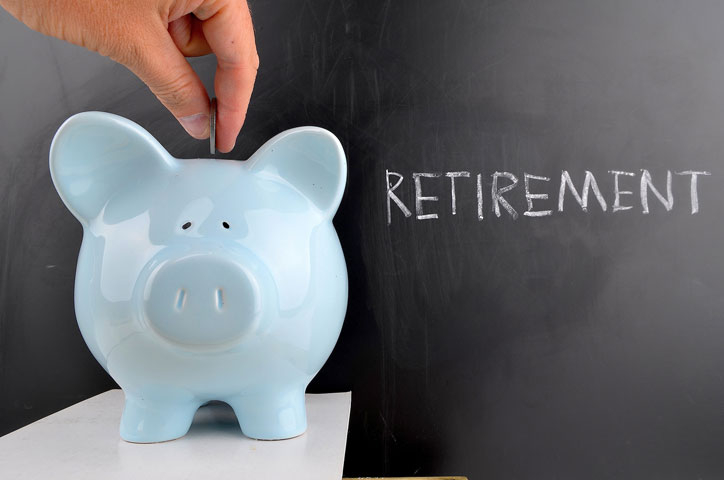Putting money in piggy bank for retirement