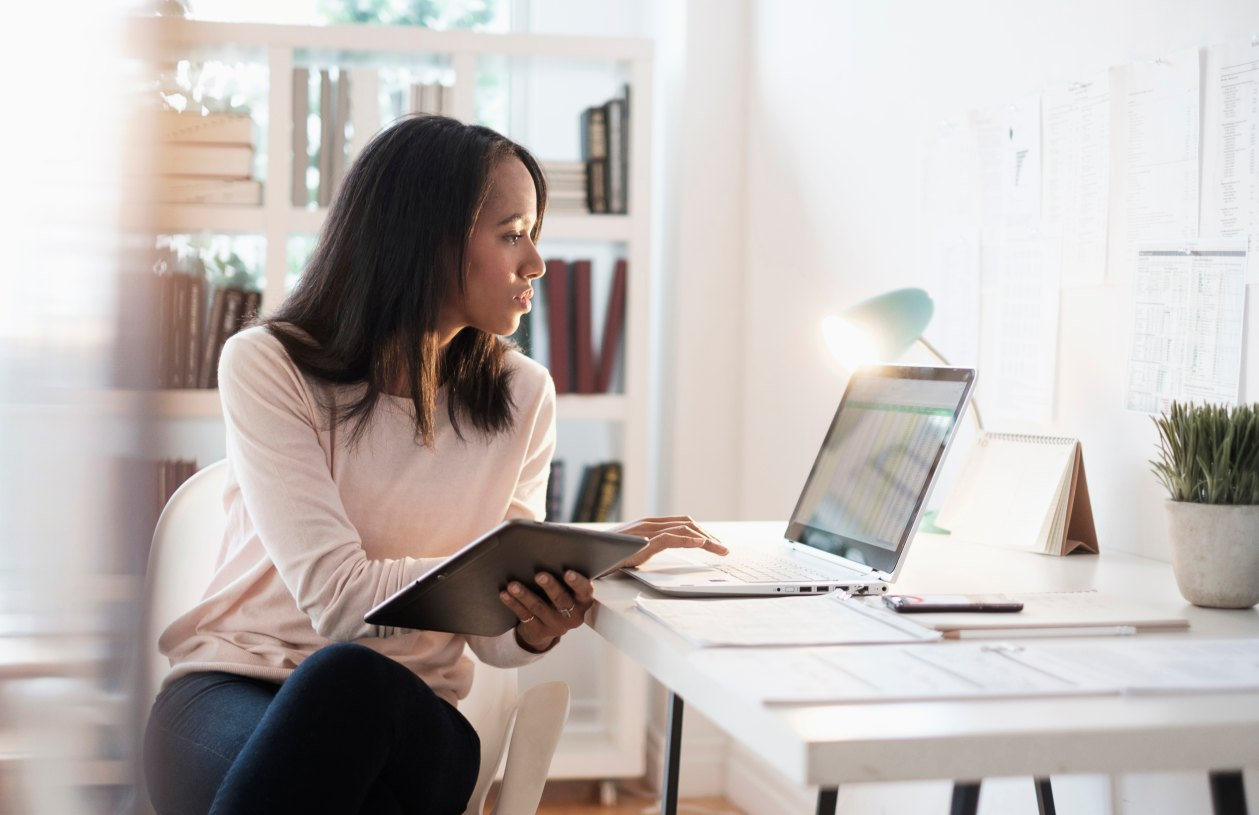 A woman uses a budgeting app.
