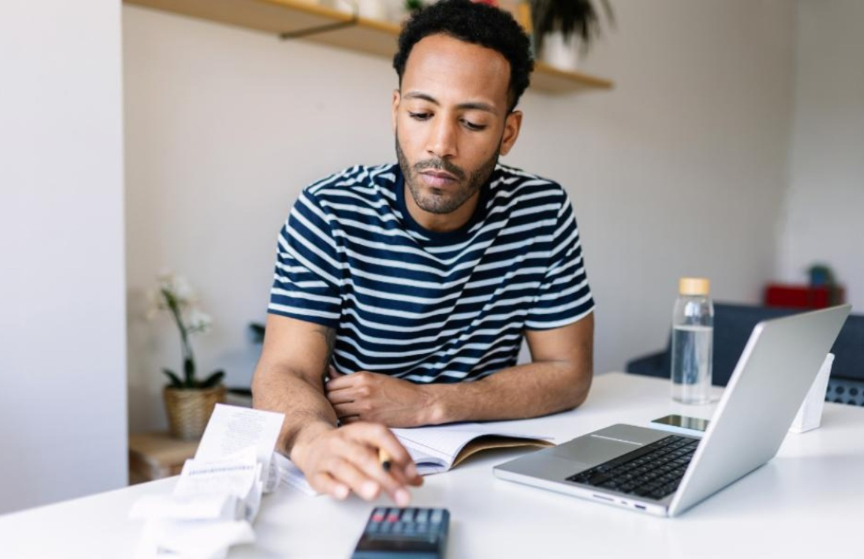 Man checks his finances digitally