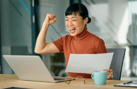 Woman excited after setting herself for financial success