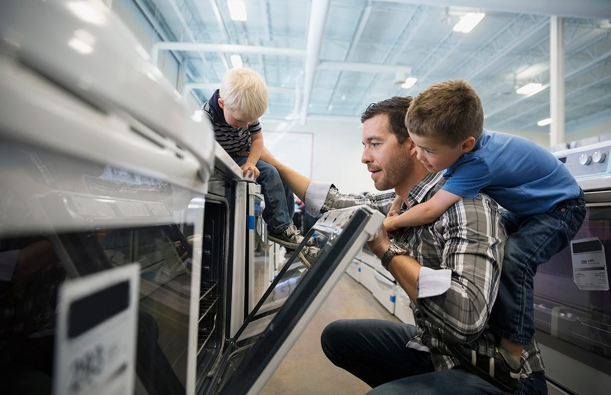 A man and his son looking at appliances