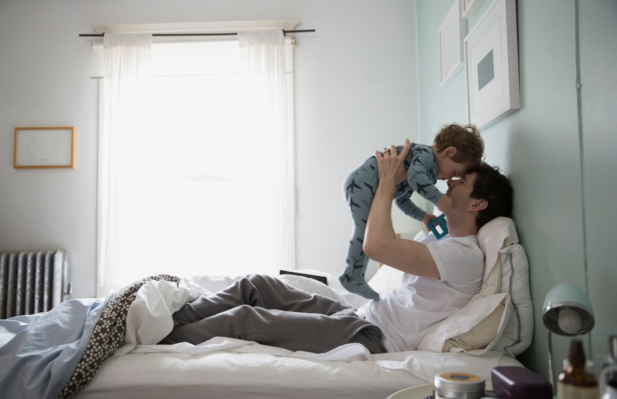 Father and son play.