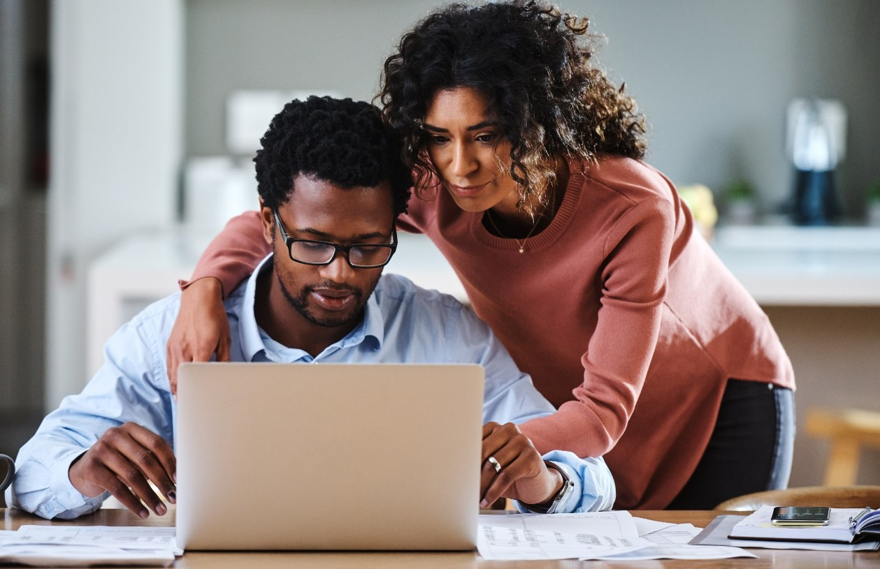 Couple looking at computer together