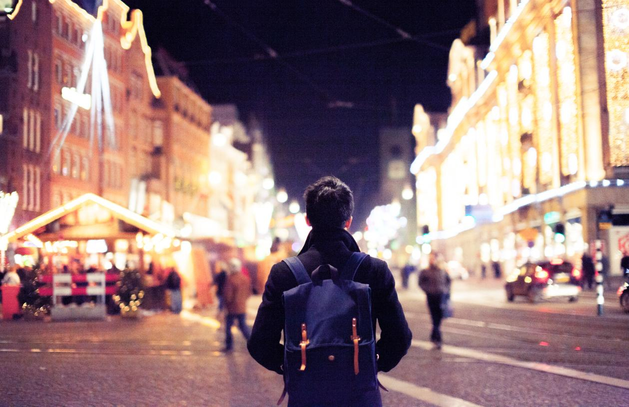 A traveler explores a city in winter.