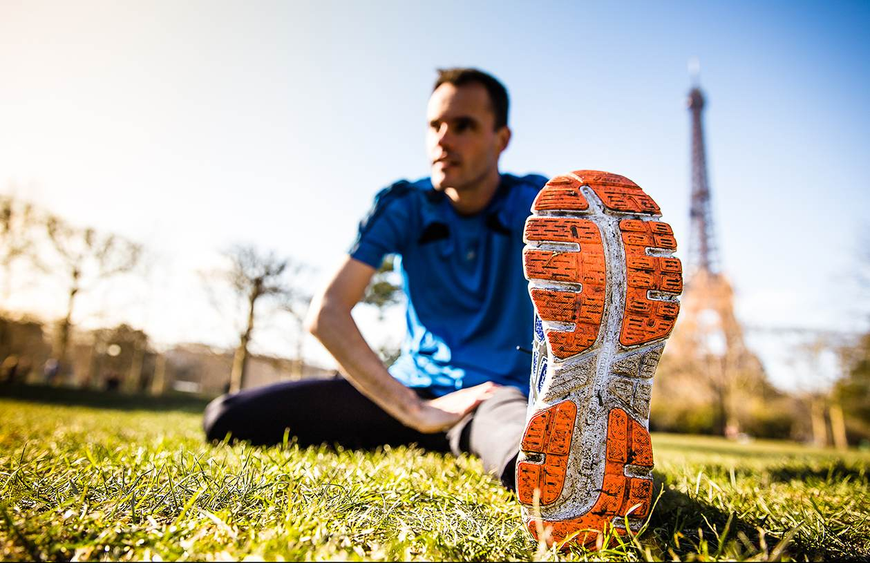 Man stretching for a race