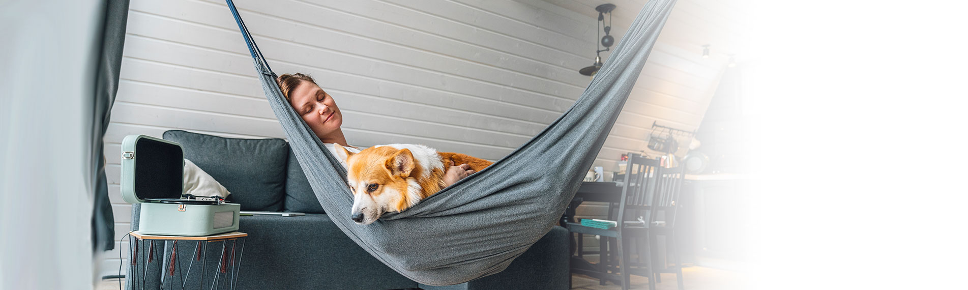 woman and dog in hammock