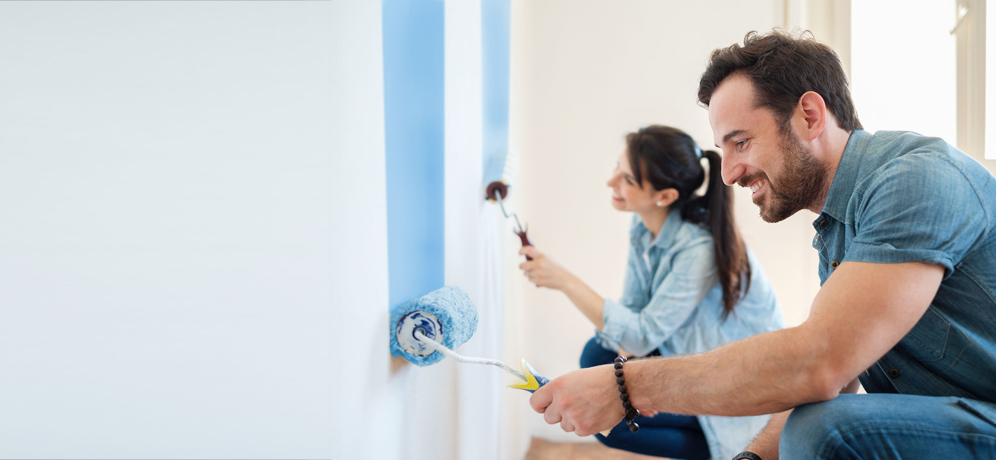 Couple painting home