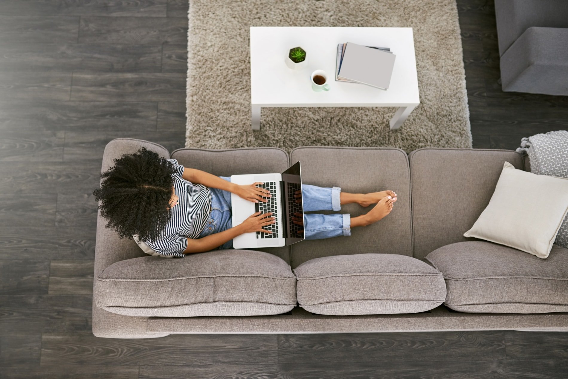 woman banking online sitting on couch